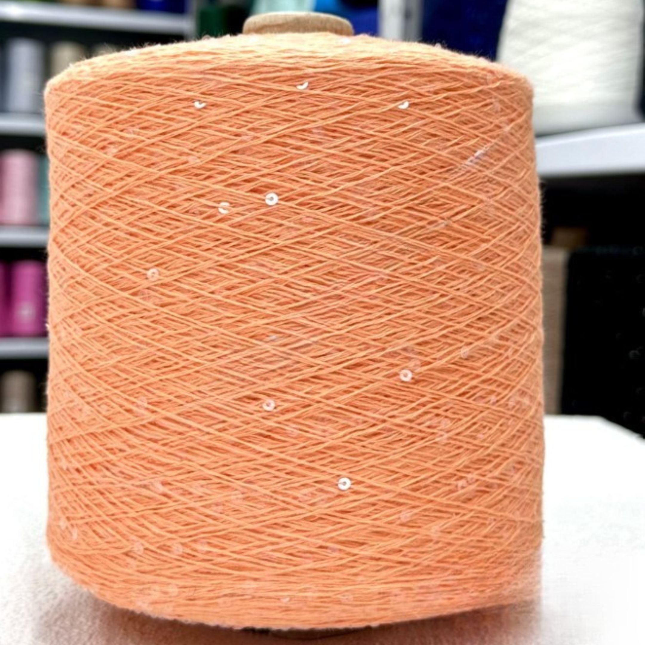 Textured knit piece with shimmering sequin effect