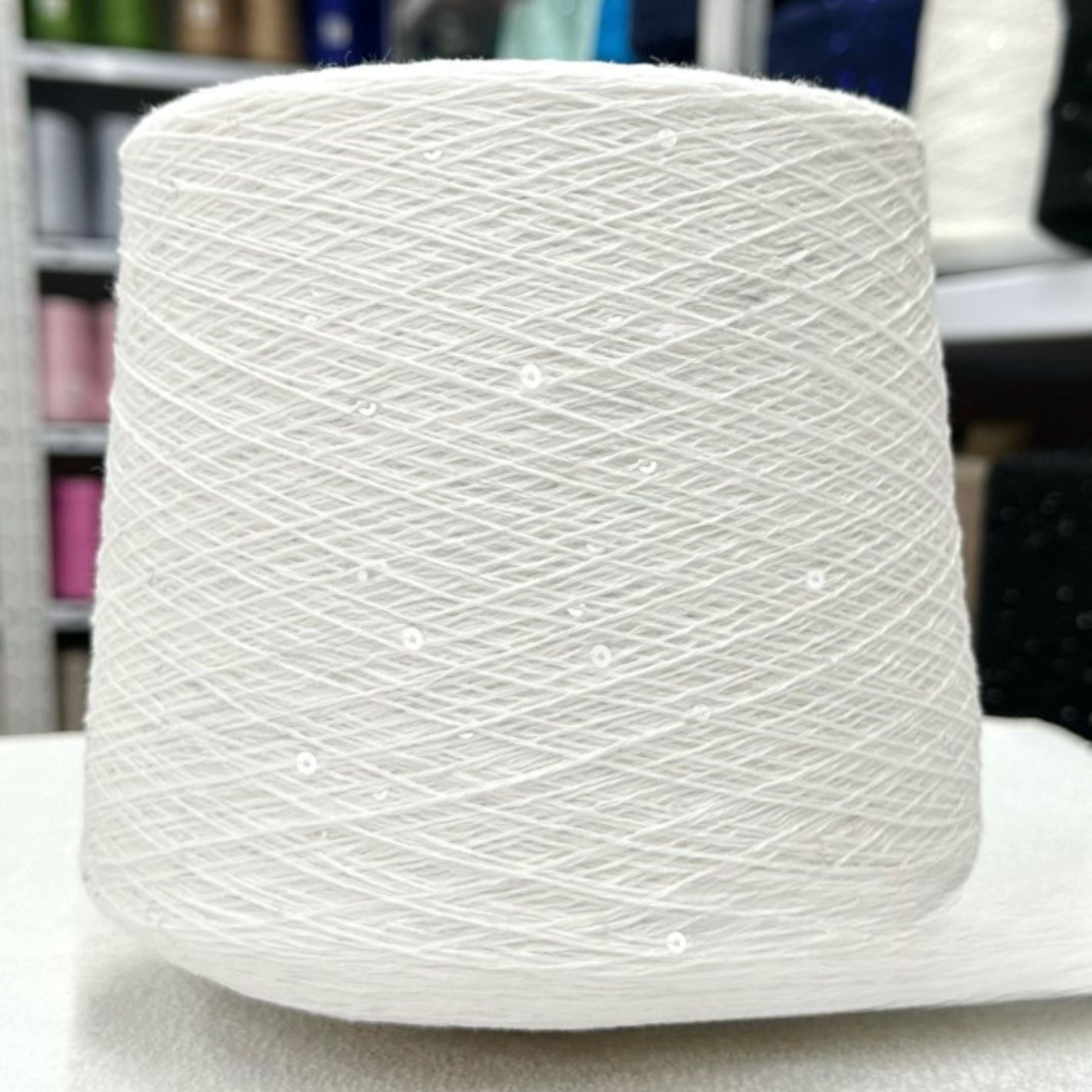 Elegant knitted sample glowing with sequins