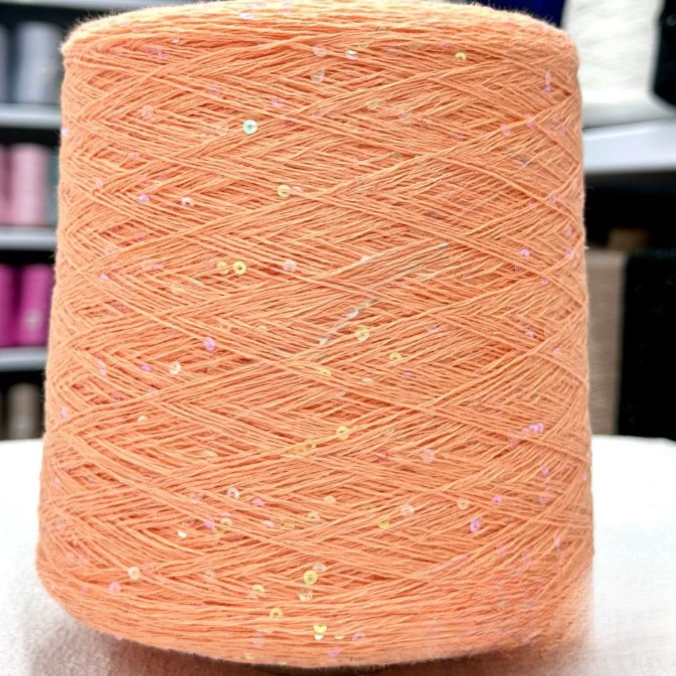 Close-up knit texture with embedded sparkling sequins