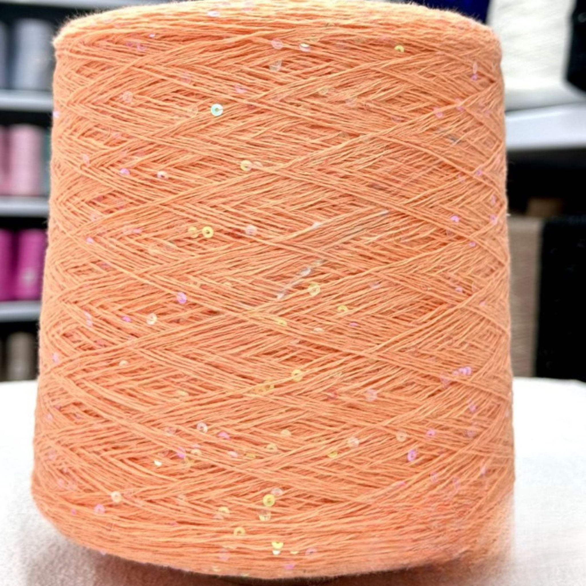 Close-up knit texture with embedded sparkling sequins