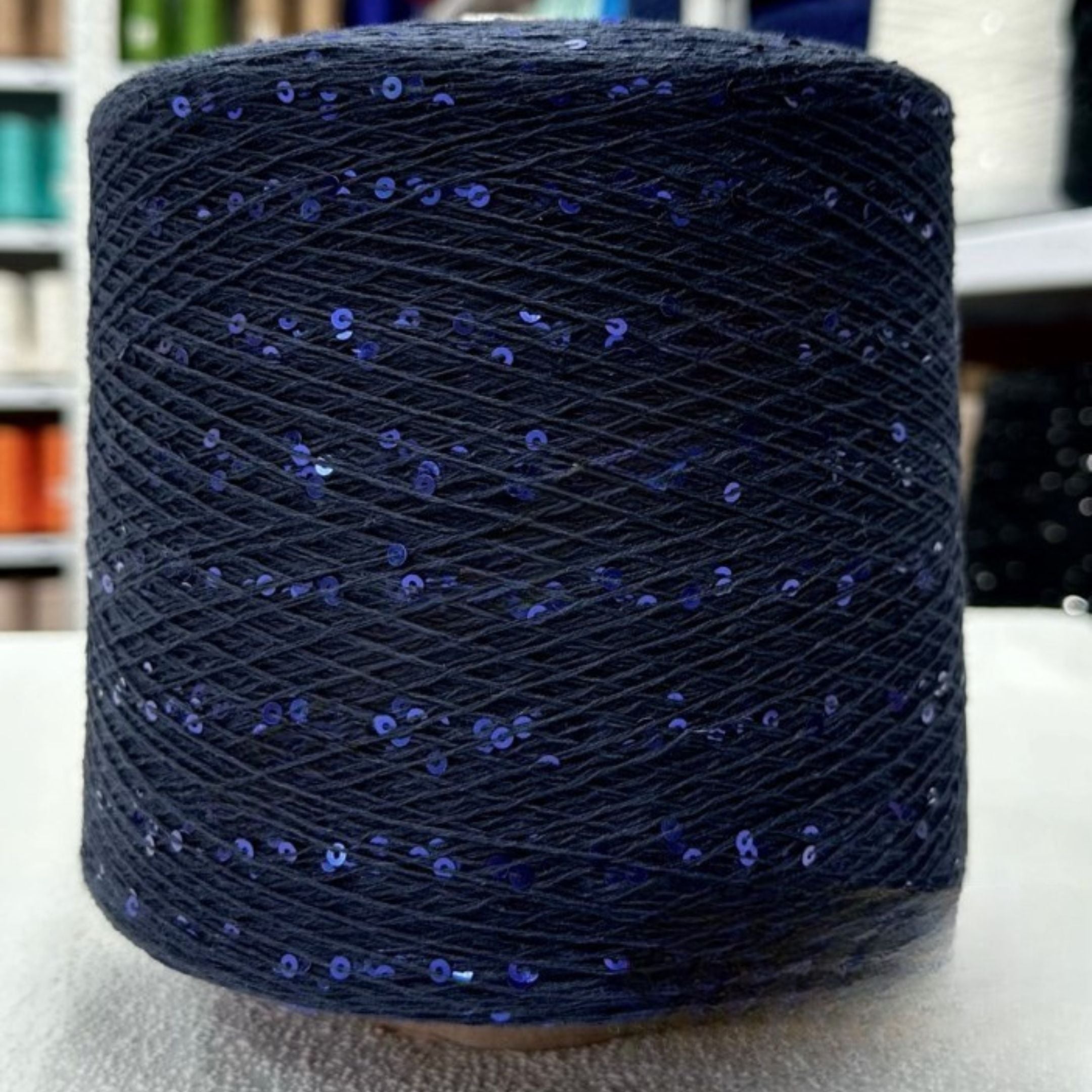 Clean studio shot of shimmering 3mm sequin cotton skein
