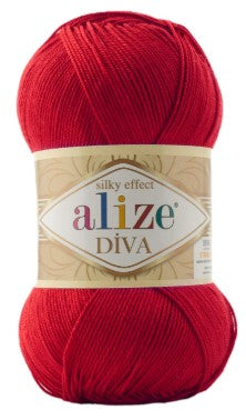 Red ball of yarn with Alize Diva 106 label on a white background