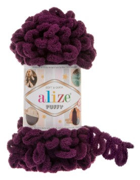 Ball of purple yarn with 'alize' label on a white background