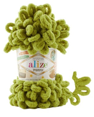 Green yarn ball with 'Alize' label on a white background