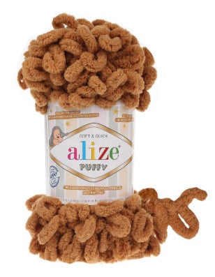 Alize Puffy yarn ball with packaging on a white background