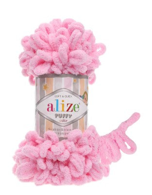 Pink pom-pom toy with a can labeled 'alize' on a white background 183 Alize Puffy