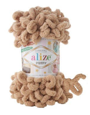 Alize Puffy 262 yarn in beige color with packaging on a white background