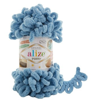 Blue yarn with a visible brand label on a white background