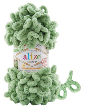 Green yarn ball with 'alize puffy 299' label on a white background