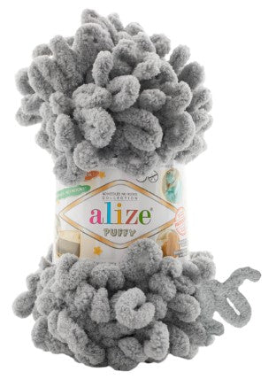 Gray yarn ball with Alize puffy 302 label on a white background