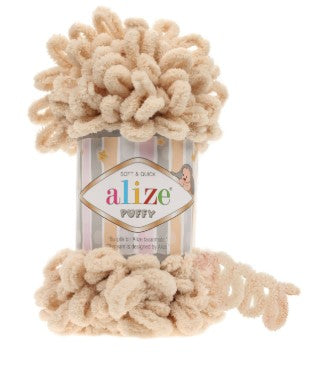 Alize puffy 310 yarn in a canister on a white background