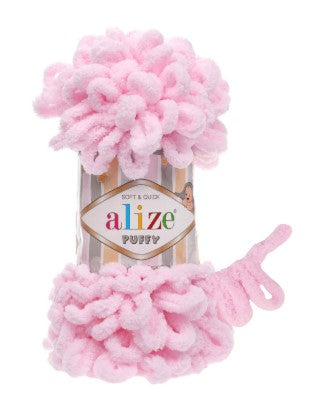 Pink yarn with a 'alize' label on a white background