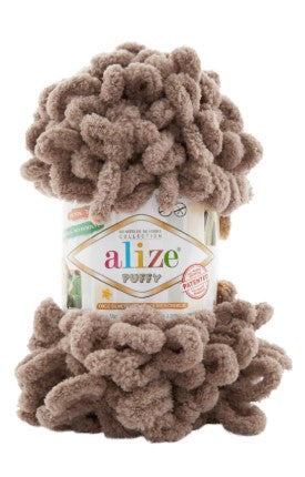 Ball of brown yarn with 'alize puffy 329' label on a white background
