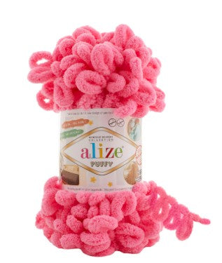 Pink yarn with a 'Alize puffy 377' label on a white background