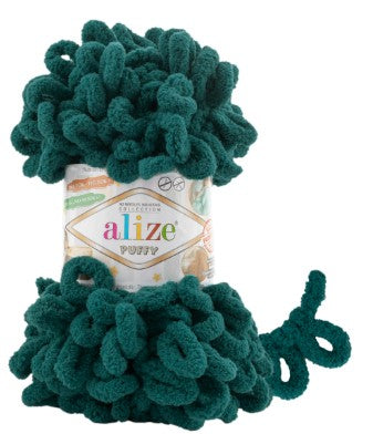 Green yarn ball with 'Alize puffy 426' label on a white background