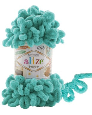 Turquoise yarn with a visible brand label on a white background