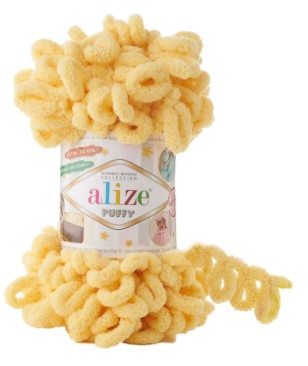 Yellow yarn with a visible puffy 509 'alize' label on a white background
