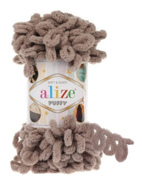 Brown yarn with packaging labeled 'alize puffy 530' on a white background