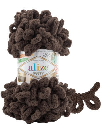 Brown yarn with a visible 'alize puffy 534' label on a white background