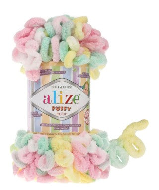 Colorful fuzzy yarn with packaging labeled 'alize 5862' on a white background