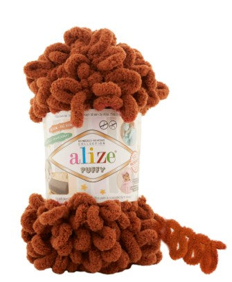 Brown yarn ball on a white background with 'alize puffy 597' label
