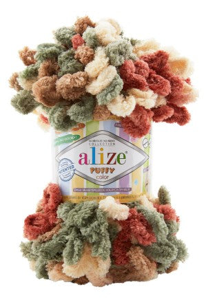 Pile of multicolored yarn with Alize 6039 label on a white background