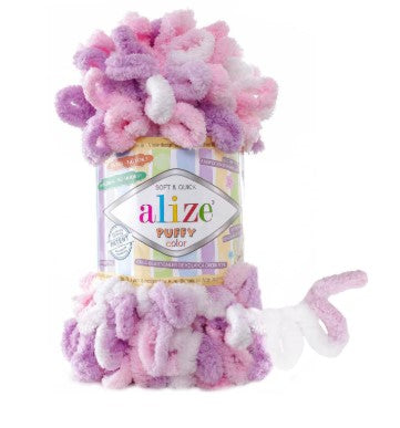 Alize Puffy yarn in pink and purple with a label on a white background