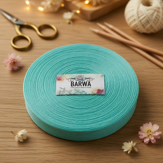 Premium turquoise t-shirt yarn roll 7-9mm made from 100% virgin cotton, chunky yarn for crochet and knitting, styled with golden scissors, knitting needles and delicate flowers on wooden background