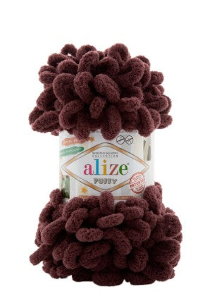Ball of brown yarn with Alize label on a white background