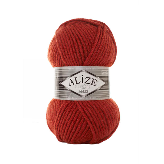 Red ball of yarn with Alize SUPERLANA MAXI36 label on a white background 