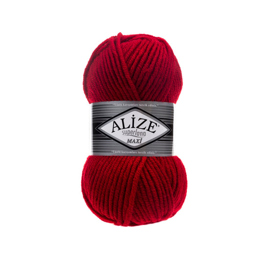 Red ball of yarn with Alize SUPERLANA  MAXI 56 label on a white background