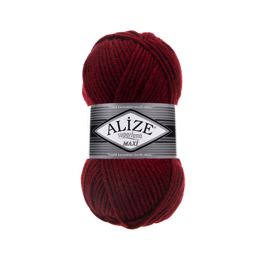 Red ball of yarn with Alize SUPERLANA MAXI 57 label on a white background