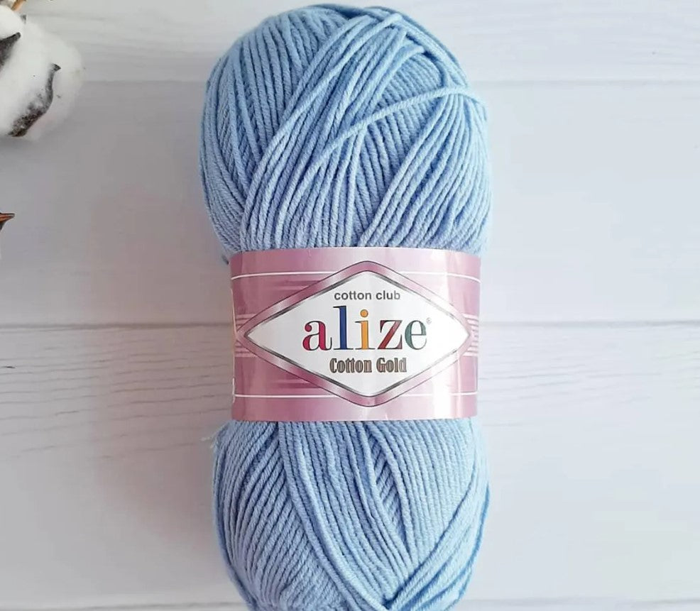 Collection of Alize Cotton Gold yarn skeins in trendy pastel shades – mint green, lavender, and dusty rose, breathable cotton blend for airy summer tops, dresses, and lightweight home decor projects