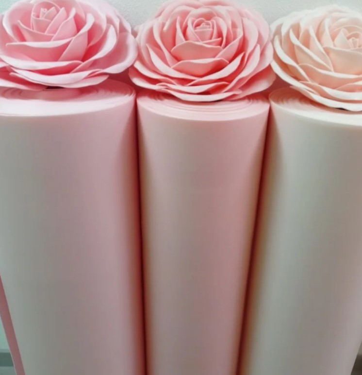Multicolored Izolon foam rolls in pink, nude, teal – 2mm thick for giant flower making. Waterproof, fade-resistant sheets for custom oversized blooms.
