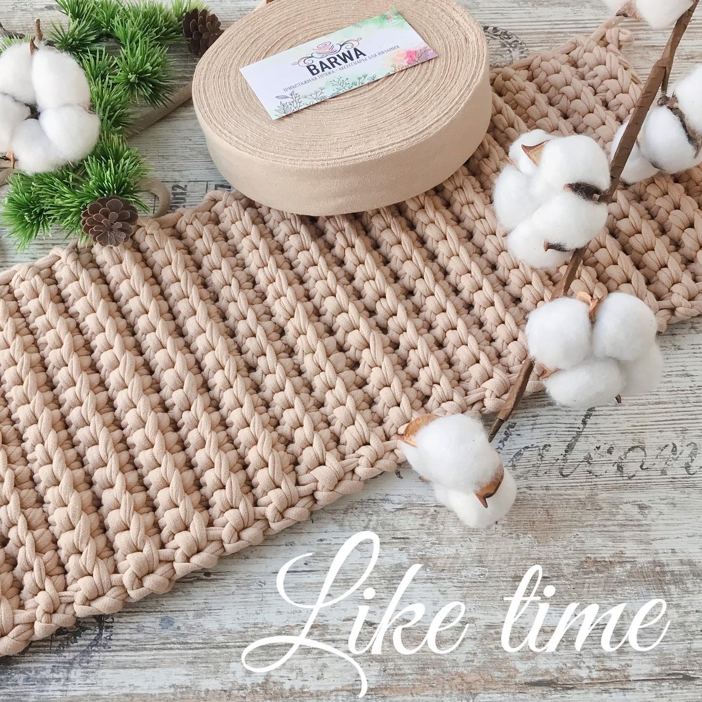 Beige premium t-shirt yarn roll 7-9mm with finished chunky knit project and cotton bolls, natural virgin cotton yarn