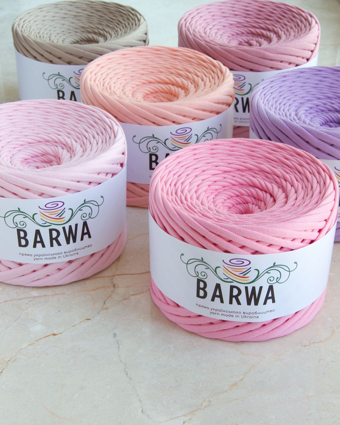 Comparison of 7-9mm rich red recycled t-shirt yarn skeins, soft stretchy eco-friendly cotton jersey yarn in vibrant color