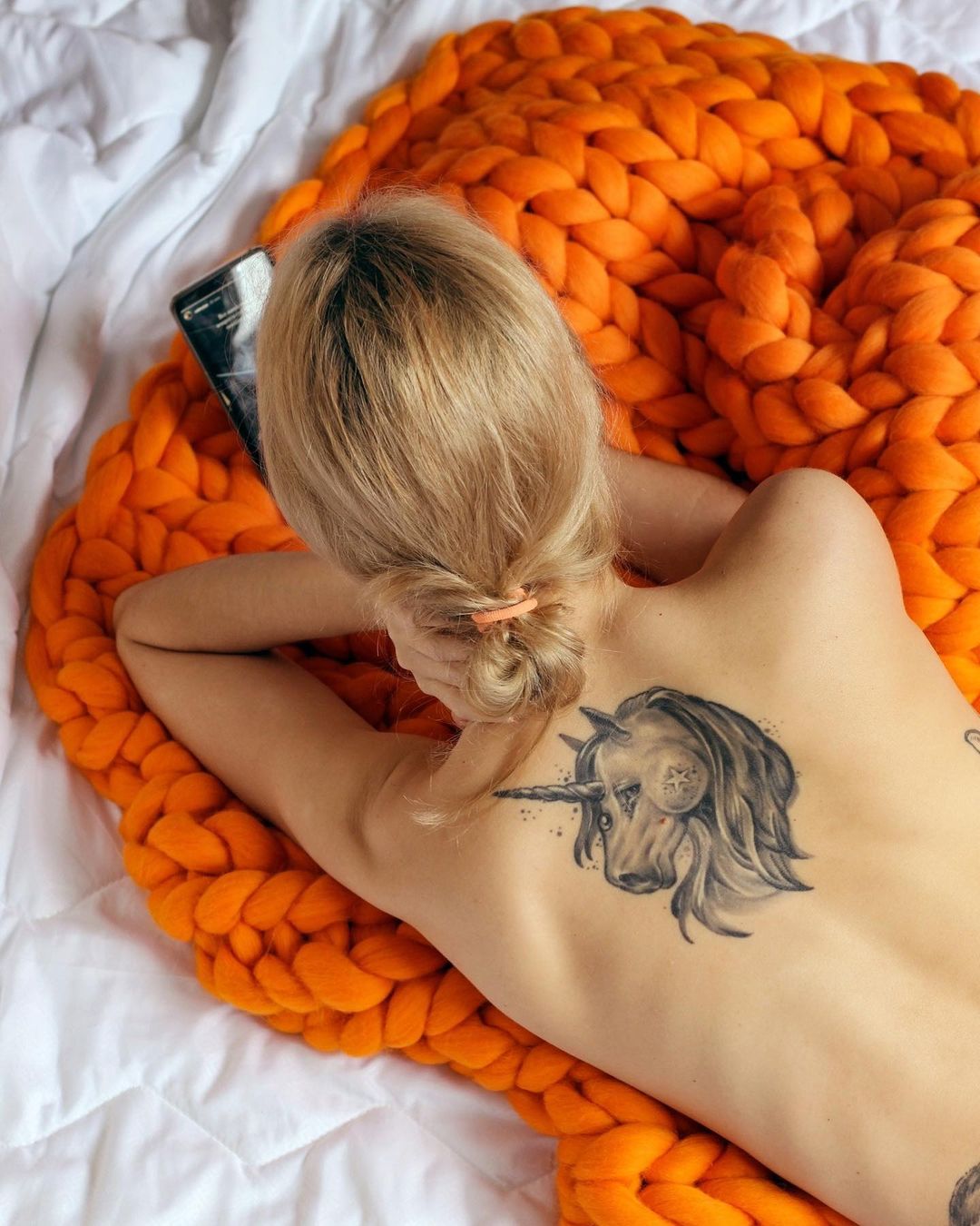 Bordeaux chunky throw draped over gray armchair